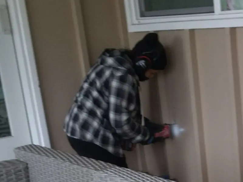 Professional electrician installing an exterior outlet in Burlington